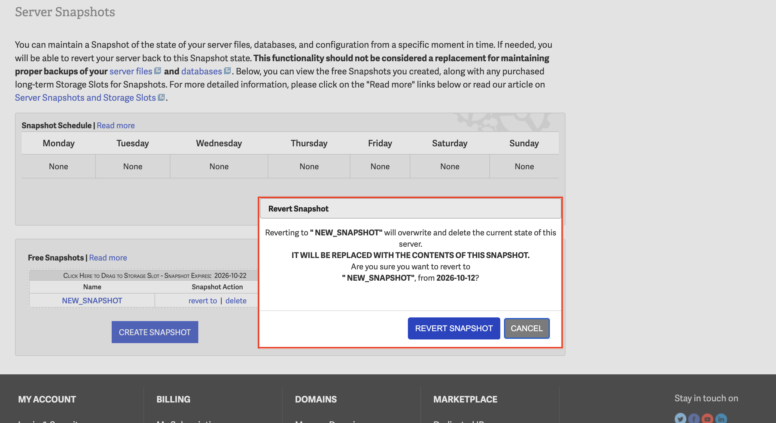 InMotion Hosting Server Snapshots page displaying the Revert Snapshot confirmation dialog with a warning about overwriting current server data.